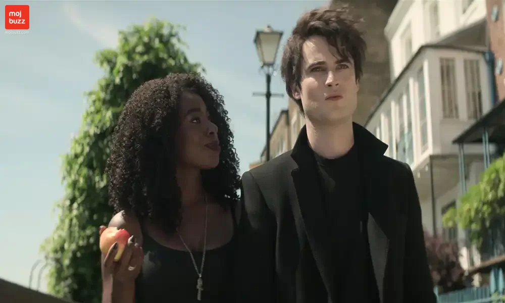 A women and man wearing black cloths and talking to each other