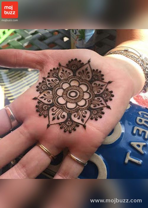 Rangloli Mehndi design on palm of a women