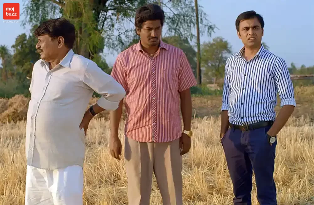 3 men are standing in a field