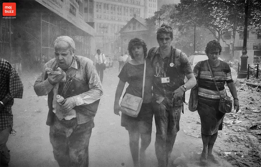 some injured people covered in dust in 9/11 attack