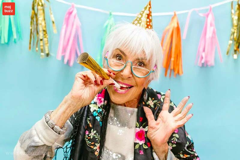 An old happy woman in a birthday party